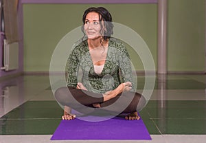 Yogi woman performing yoga asana in fitness class