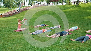 Yogi woman plays chimes during group meditation, group enjoys sound healing