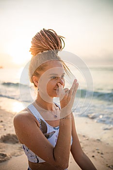 Yogi woman practicing Nadi Shodhana Pranayama  Alternate Nostril Breathing. Control prana  control of breath. Breathing exercise. photo