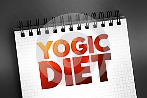 Yogic diet text on notepad, concept background