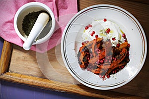 Yogurt with baked pumpkin, zaatar and pomegranate, healthy