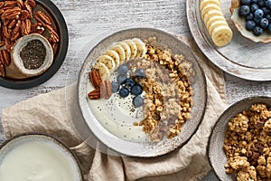 Yogurt with chocolate granola, blueberry. Breakfast, healthy diet food with oat flakes