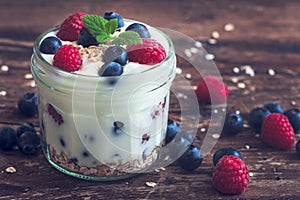 Yogurt with Fresh Berries on Woden Table