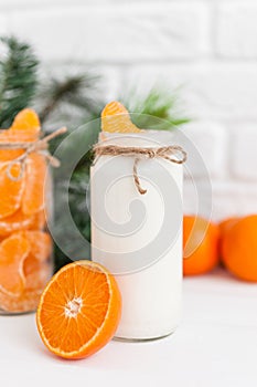 Yogurt with fresh orange slices and whole oranges