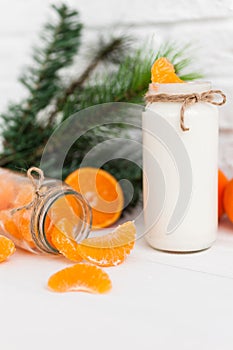 Yogurt with fresh orange slices and whole oranges