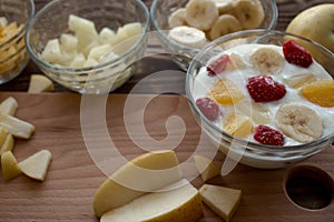 Yogurt with fruits orange bananna pineapple apple