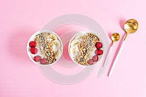 Yogurt with granola, chia seed, raspberry and banana, healthy breakfast concept