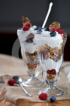 Yogurt, Granola and Fruit in Parfait Glasses and Spoon