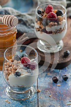 Yogurt with granola and raspberries black chorynitsa and honey