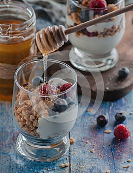 Yogurt with granola and raspberries black chorynitsa and honey