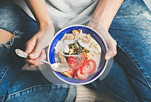 Yogurt, granola, seeds, fresh, dry fruits and honey in bowl