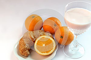 Yogurt milk and orange ,croissants