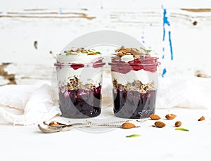 Yogurt oat granola with berries, honey and nuts in