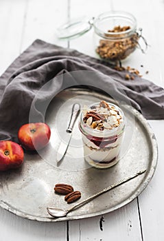 Yogurt oat granola with berries, honey, nuts and