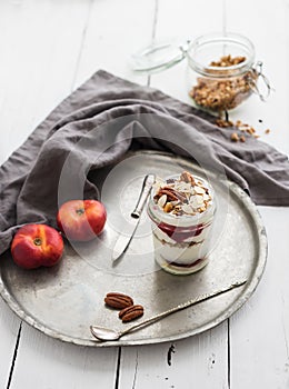 Yogurt oat granola with berries, honey, nuts and