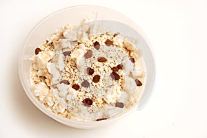 Yogurt with oatmeal, raisins and puffed rise photo