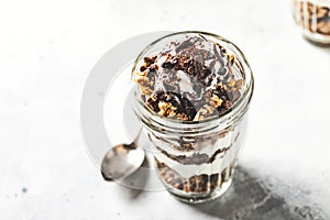 Yogurt parfait with granola, chocolate and ice cream