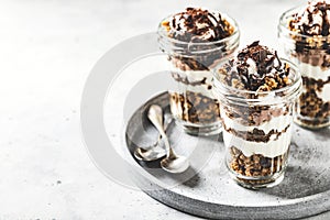 Yogurt parfait with granola, chocolate and ice cream