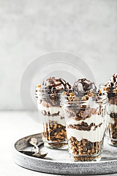 Yogurt parfait with granola, chocolate and ice cream