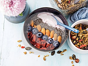 Yogurt smoothie bowl with berries, chia, granola