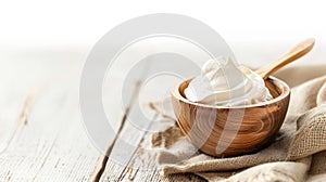 Yogurt or sour cream in a wooden bowl