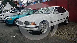 White BMW 316i E36 compact on parking lot