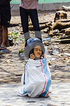 Children wearing a helmet having a sack race