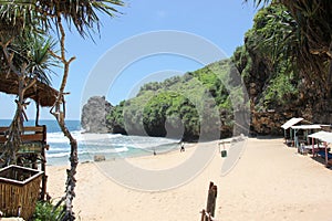 The atsmosphere during the day at ngrawah beach, with a brigh t blue sky