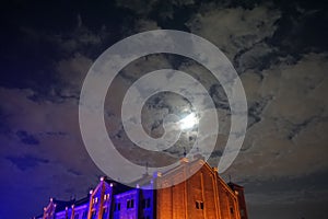 Yokohama Red Brick Warehouse building. Bright moon in the night sky