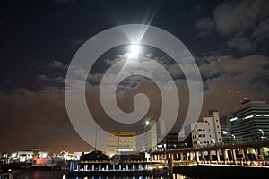 Yokohama waterfront. Bright moon in the night sky