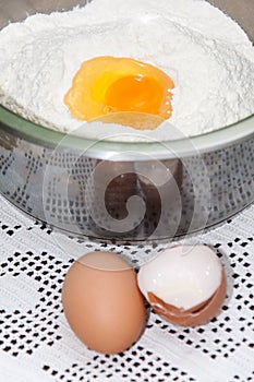 Yolk in the bowl with flour