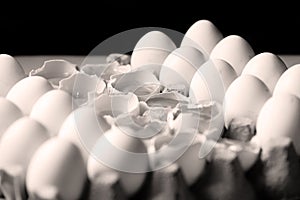 Yolk among many white eggs