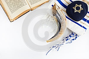 Yom kippur, Rosh hashanah, jewish New Year holiday, concept. Religion image of shofar - horn on white prayer talit.