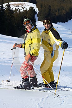 Yong family skiers on ski slope photo