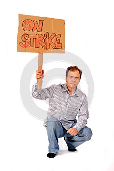 Yong man holding On Strike sign