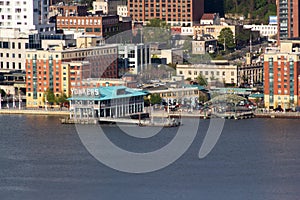 Yonkers, NY / United States - May 2, 2020: Close up view of the Yonker`s downtown waterfront along the Hudson River at Sunset