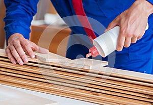 Yooung repairman carpenter working with paint painting