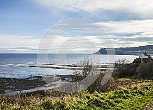 Yorkshire, England, Robin Hood`s Bay - the sea and the meadows.