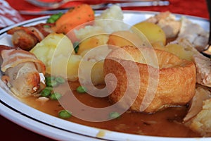 Yorkshire pud with meat and vegetables photo