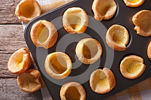 Yorkshire puddings in baking dish closeup. horizontal top view