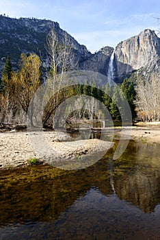 Yosemite Fall and reflection in a river