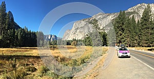 Yosemite National Park has people hiking and travel with grass land and Stone Mountain