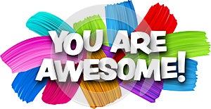 You are awesome paper word sign with colorful spectrum paint brush strokes over white