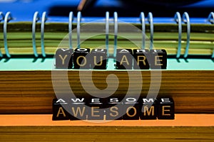 You are awesome on wooden blocks. Education and business concept