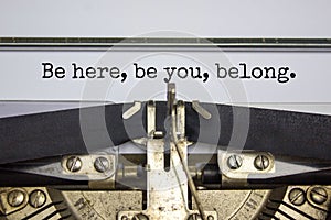 You belong here symbol. Words `Be here, be You, belong` typed on retro typewriter. Diversity, inclusion, belonging and you belon