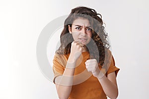 You better not mess me. Portrait intense pissed young woman wanna punch you raise fists standing defensive boxing pose