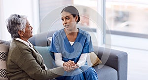 You can confide all in me. a young nurse chatting to a senior woman in a retirement home. photo