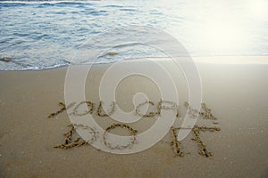 You can do it. Motivational inspirational message concept written on the sand of beach.