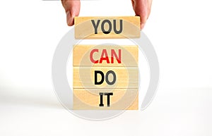 You can do it symbol. Concept word You can do it on beautiful wooden block. Beautiful white table white background. Businessman
