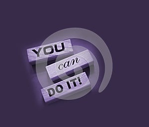 YOU CAN DO IT word on wooden blocks on gray background. Motivation affirmation encouraging words for personal